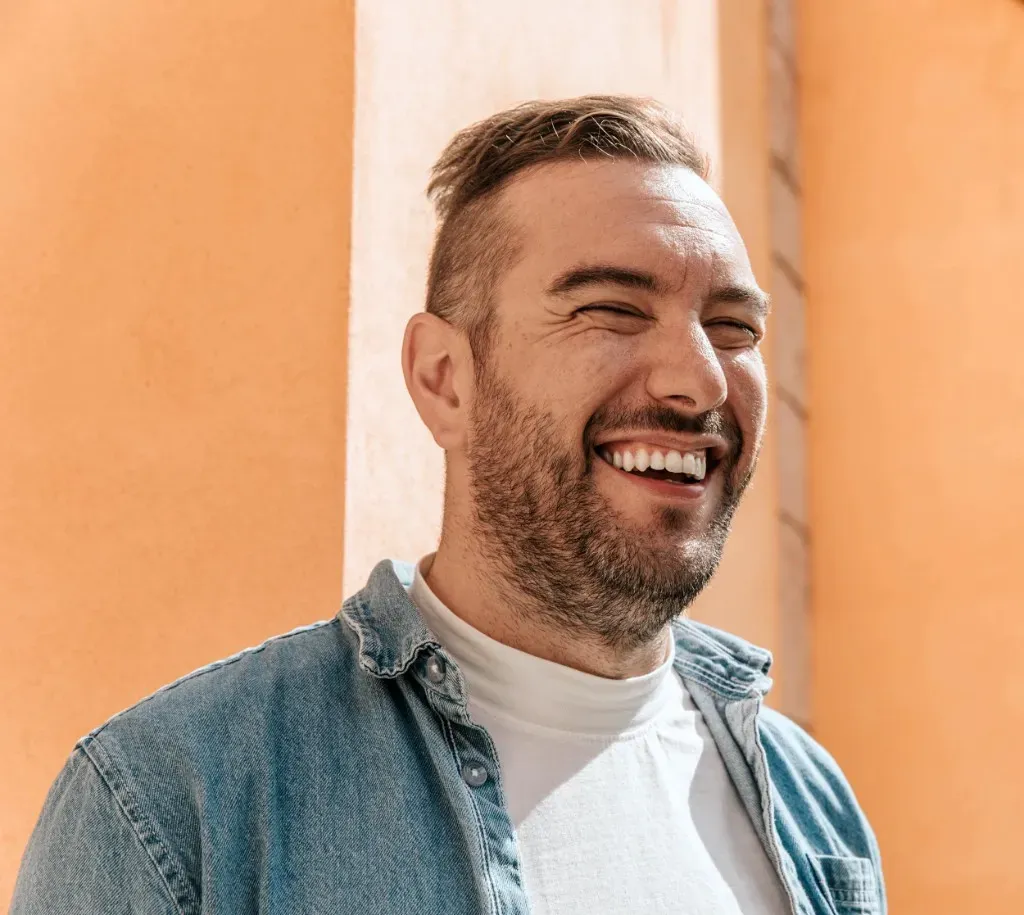 Happy man laughing