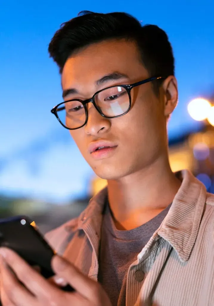 Employee reviewing TalkLife Workplace on their phone at night